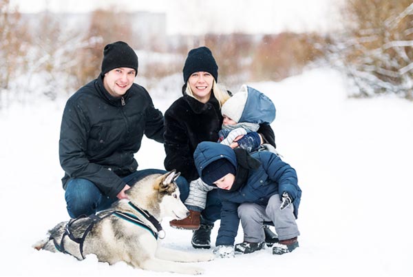 Family With Dog in Snow