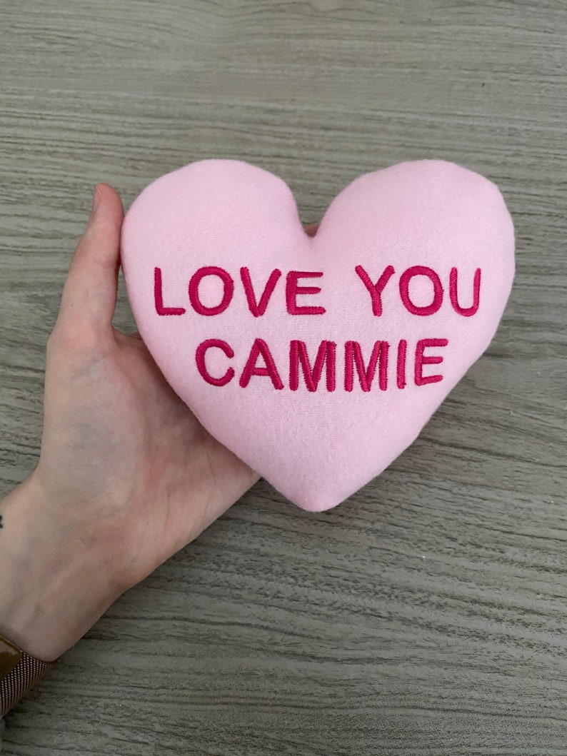 https://pamperedpawgifts.com/ppgwp/wp-content/uploads/2021/12/Personalized-Heart-Squeaker-Dog-Toy-Custom-Puppy-Toy-Handmade-Dog-Toy-Dog-Gift-for-Dog-Lover-Conversation-Heart-Dog-Toy-Vegan.jpg